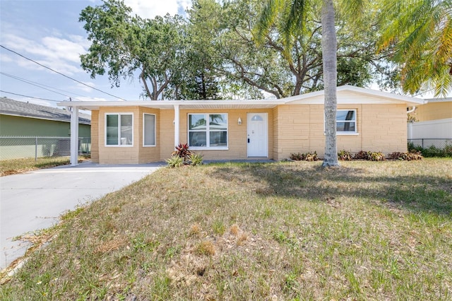 13926 Helen Ave, Hudson, FL 34667 - single story home with fence, concrete driveway, and a front yard