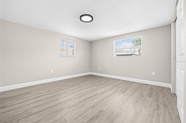 13926 Helen Ave, Hudson, FL 34667 - empty room with baseboards and light wood-style flooring