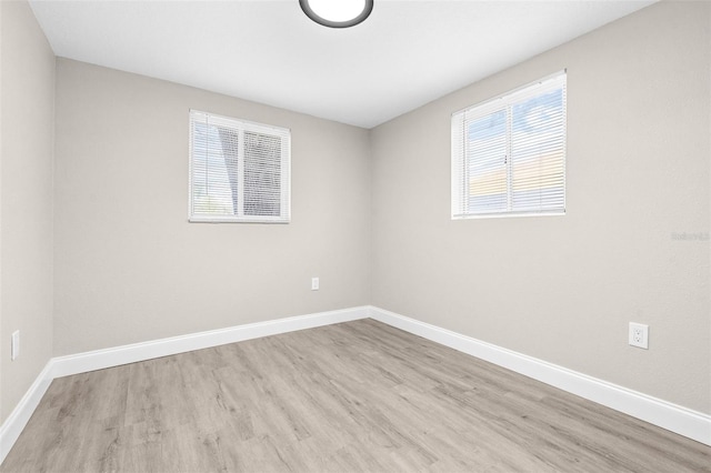 13926 Helen Ave, Hudson, FL 34667 - unfurnished room with baseboards and wood finished floors