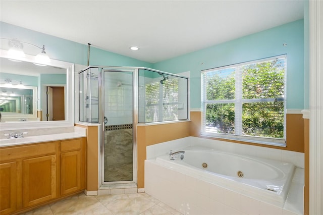 full bath with vanity, a shower stall, and a jetted tub