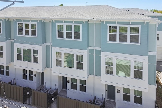 2123 1st Ave N, Saint Petersburg, FL 33713 - view of property featuring a fenced front yard and a shingled roof