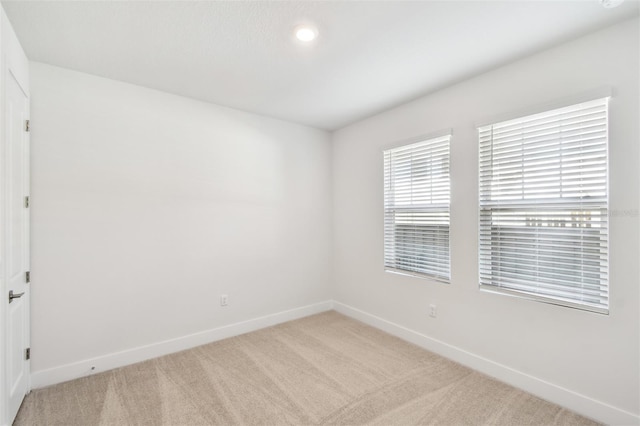 2123 1st Ave N, Saint Petersburg, FL 33713 - carpeted empty room featuring baseboards and recessed lighting