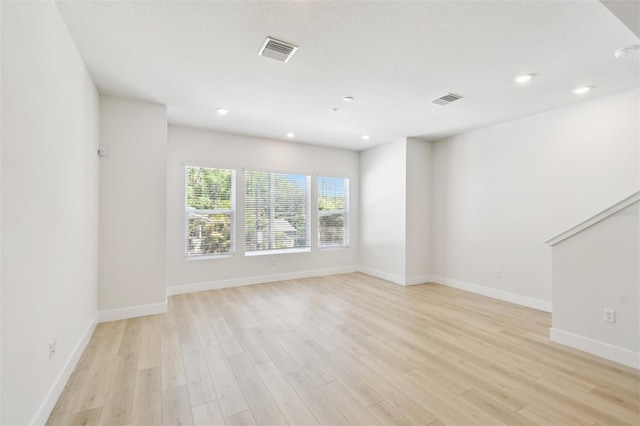 2123 1st Ave N, Saint Petersburg, FL 33713 - unfurnished room featuring light wood-style floors, baseboards, and recessed lighting