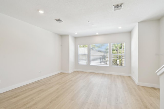 2123 1st Ave N, Saint Petersburg, FL 33713 - empty room featuring light wood-style floors, baseboards, and recessed lighting