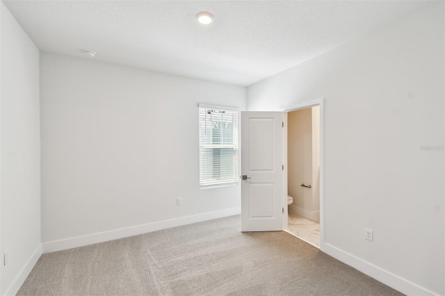2123 1st Ave N, Saint Petersburg, FL 33713 - carpeted spare room with baseboards and a smoke detector