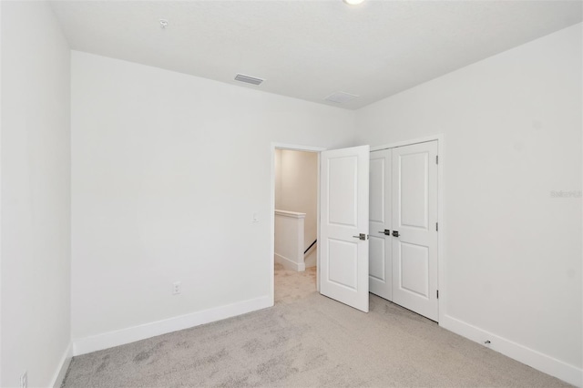 2123 1st Ave N, Saint Petersburg, FL 33713 - unfurnished bedroom featuring carpet and baseboards
