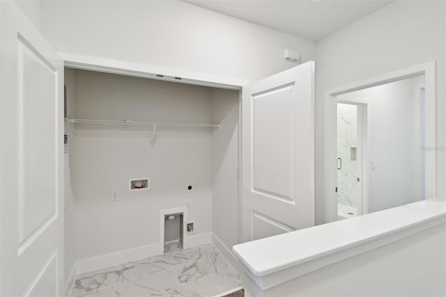 2123 1st Ave N, Saint Petersburg, FL 33713 - laundry room featuring electric dryer hookup, washer hookup, light marble finish flooring, and baseboards