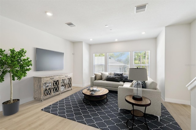 2123 1st Ave N, Saint Petersburg, FL 33713 - living area featuring wood finished floors, baseboards, and recessed lighting