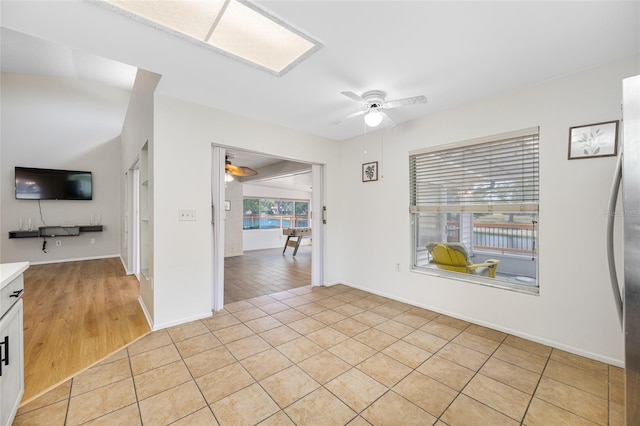 709 47th St E, Bradenton, FL 34208 - spare room featuring baseboards, a ceiling fan, and light tile patterned floors
