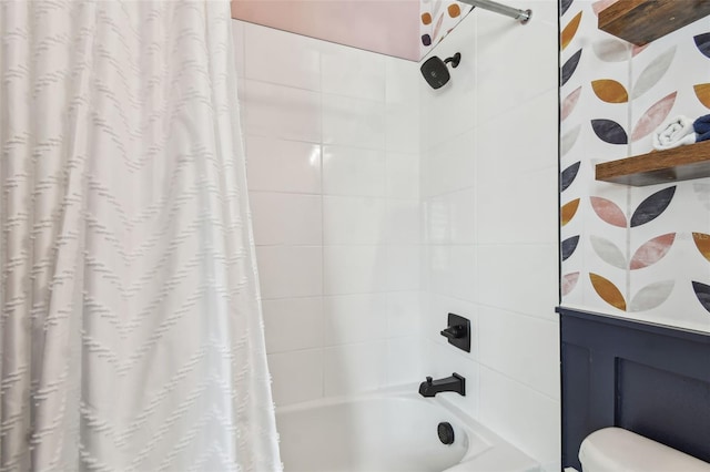 full bathroom featuring shower / bath combo with shower curtain and toilet