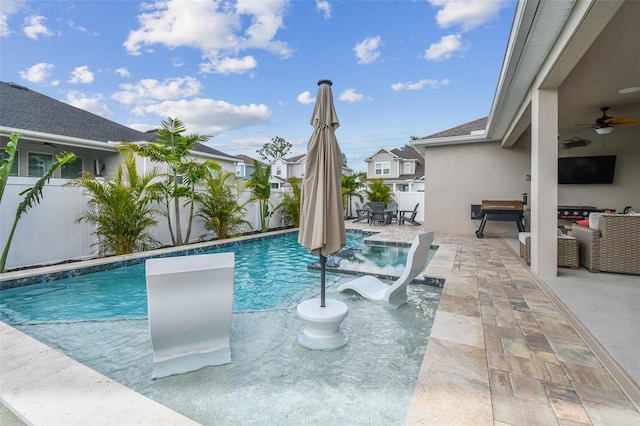 view of swimming pool featuring ceiling fan, a fenced in pool, a fenced backyard, and a patio area