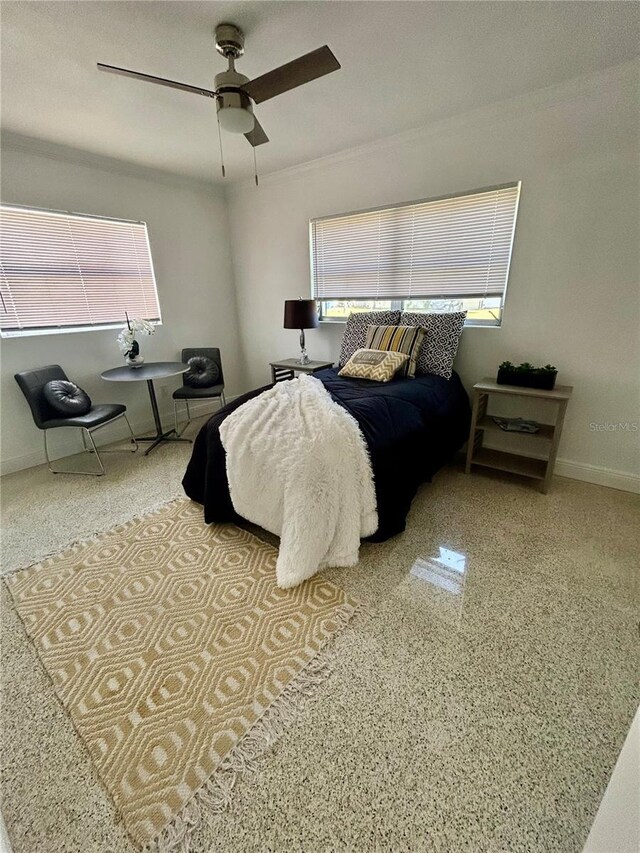 bedroom featuring baseboards and a ceiling fan