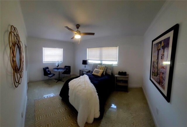 carpeted bedroom featuring baseboards, a ceiling fan, and ornamental molding