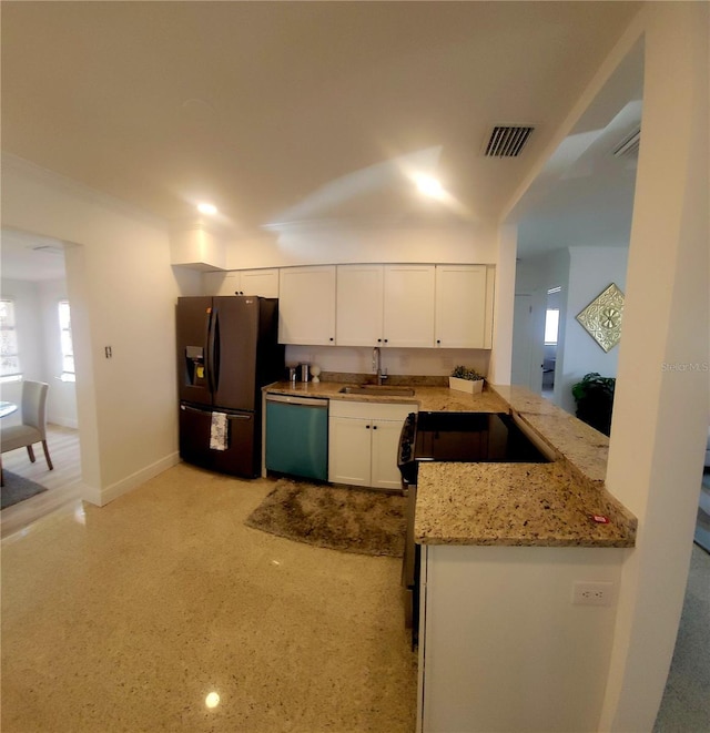 kitchen featuring black fridge with ice dispenser, visible vents, a sink, dishwasher, and range with electric cooktop