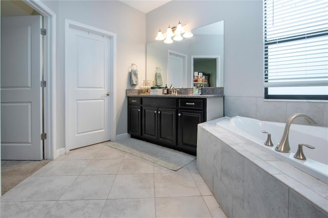 full bathroom featuring vanity, tile patterned flooring, and a bath