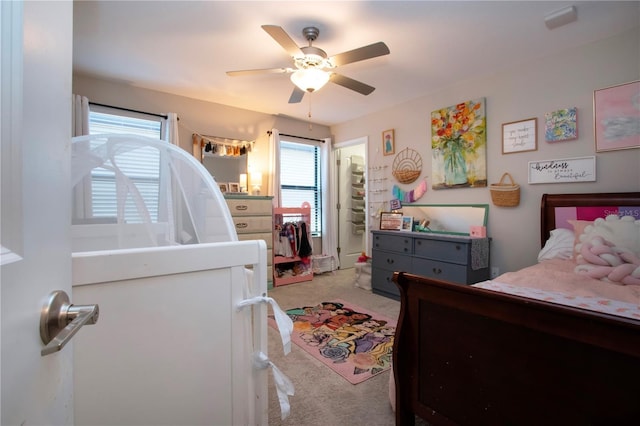 bedroom with ceiling fan and light colored carpet