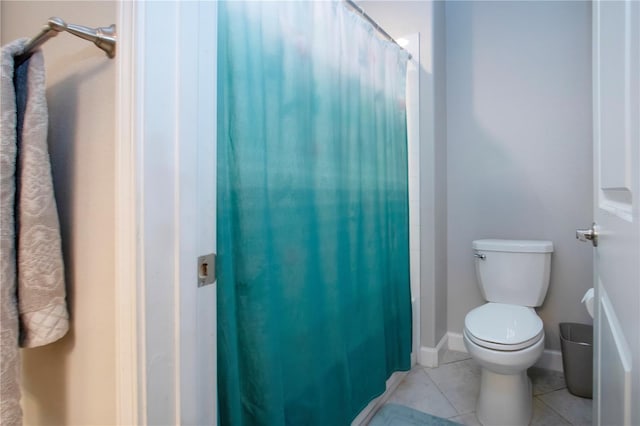 full bathroom with tile patterned floors and toilet