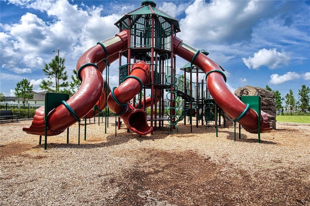 communal playground featuring fence