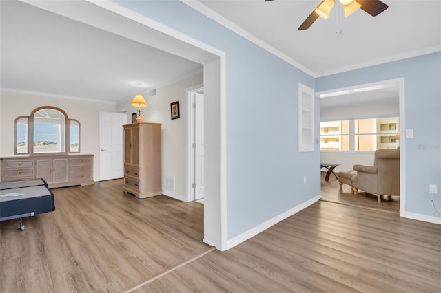 4725 Cove Cir Unit 601, Saint Petersburg, FL 33708 - hall featuring ornamental molding, wood finished floors, and baseboards