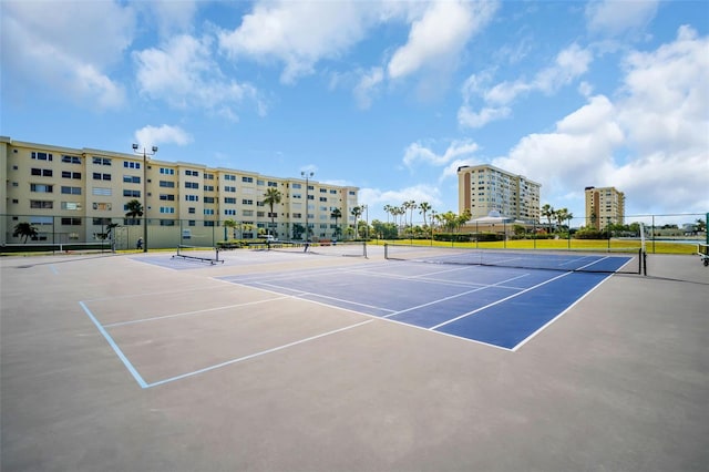 4725 Cove Cir Unit 601, Saint Petersburg, FL 33708 - view of tennis court featuring fence and community basketball court