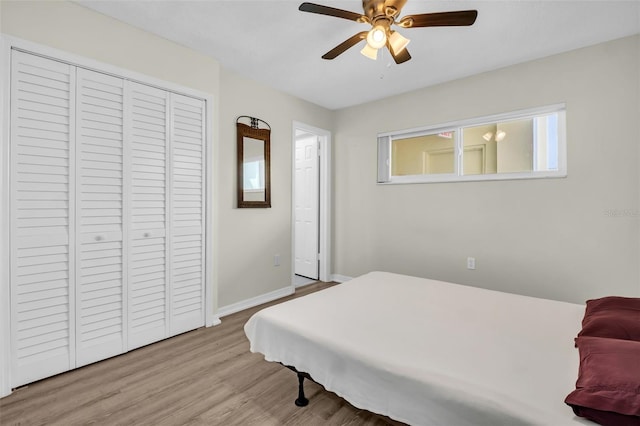 4725 Cove Cir Unit 601, Saint Petersburg, FL 33708 - bedroom featuring wood finished floors, baseboards, a closet, and ceiling fan