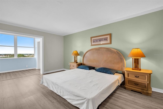 4725 Cove Cir Unit 601, Saint Petersburg, FL 33708 - bedroom featuring wood finished floors and baseboards