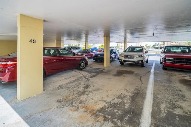 4725 Cove Cir Unit 601, Saint Petersburg, FL 33708 - view of car parking with a parking garage
