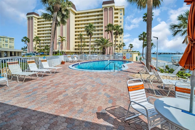 4725 Cove Cir Unit 601, Saint Petersburg, FL 33708 - community pool with a patio area and fence