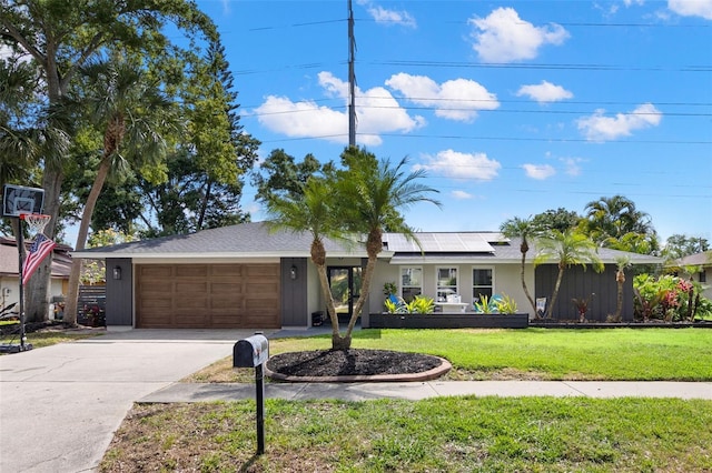 820 Hickory Ln, Palm Harbor, FL 34683 - single story home featuring a front yard, stucco siding, concrete driveway, an attached garage, and solar panels