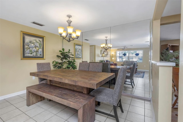 dining room featuring visible vents, baseboards, light tile patterned flooring, and a chandelier