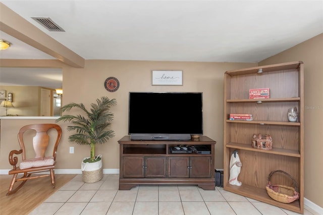 living area featuring visible vents and baseboards