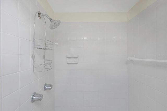 full bathroom featuring tiled shower
