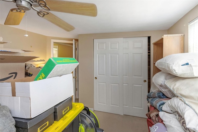 bedroom featuring ceiling fan, light colored carpet, and a closet