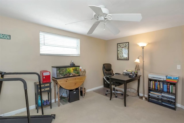 office area with baseboards, ceiling fan, and carpet floors