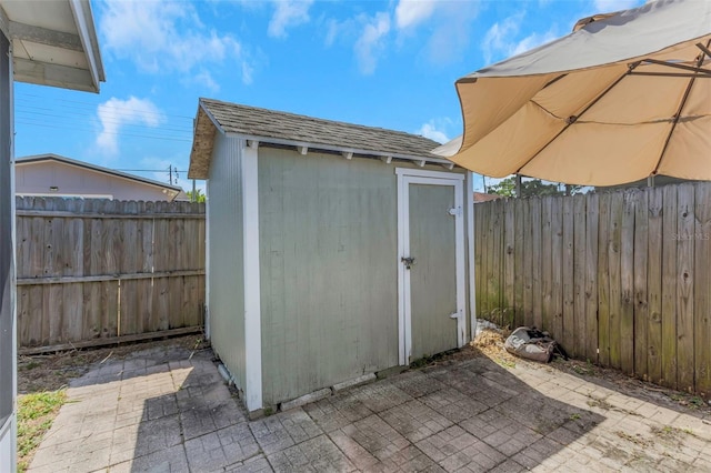 view of shed featuring a fenced backyard