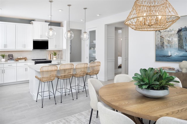 dining space featuring an inviting chandelier and recessed lighting