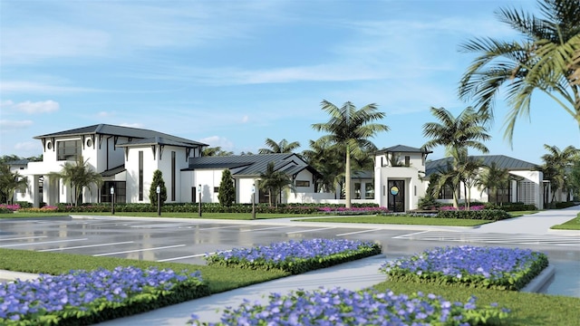 view of building exterior featuring a residential view and uncovered parking