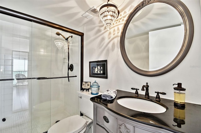 full bath with toilet, vanity, visible vents, and a shower stall