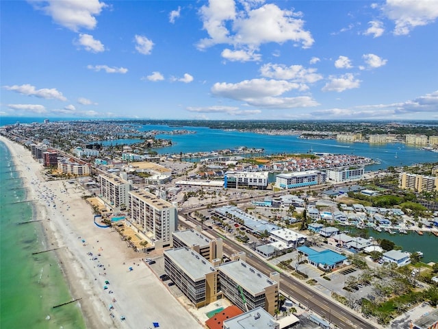 drone / aerial view with a beach view, a water view, and a city view