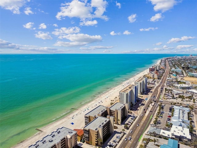drone / aerial view with a beach view, a water view, and a view of city