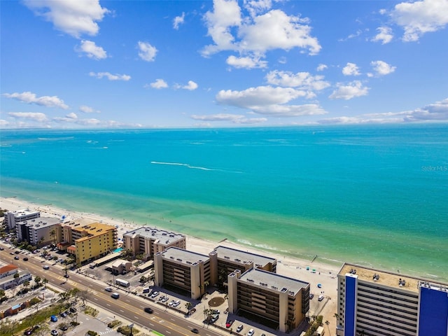 drone / aerial view featuring a water view and a beach view