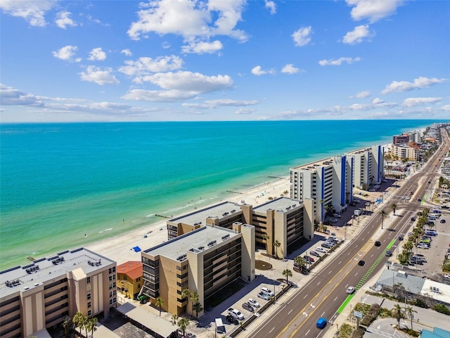 birds eye view of property featuring a water view and a view of the beach