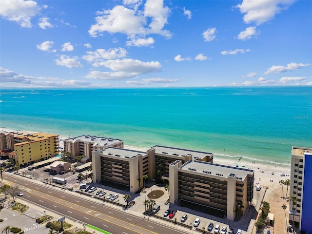 birds eye view of property featuring a view of the beach and a water view