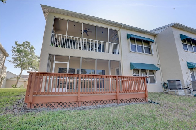 back of house with a wooden deck, stucco siding, and central AC