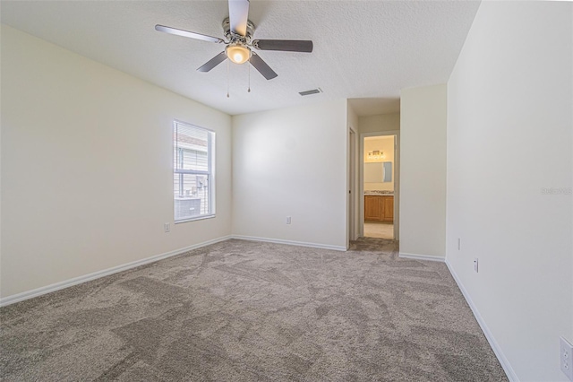 29436 Zeller Ave, San Antonio, FL 33576 - unfurnished room with carpet flooring, a textured ceiling, a ceiling fan, and baseboards