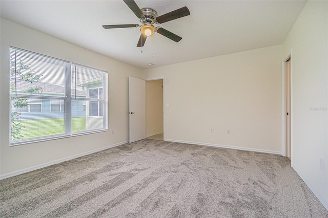 29436 Zeller Ave, San Antonio, FL 33576 - spare room featuring light colored carpet, ceiling fan, and baseboards