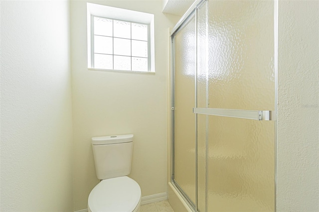 29436 Zeller Ave, San Antonio, FL 33576 - bathroom with toilet, a stall shower, and tile patterned flooring