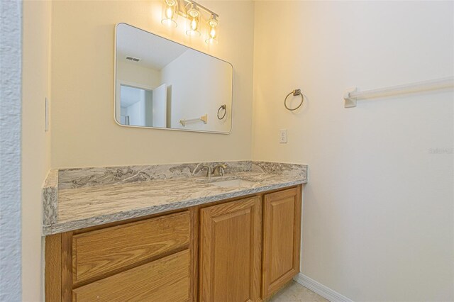 29436 Zeller Ave, San Antonio, FL 33576 - bathroom with vanity and baseboards