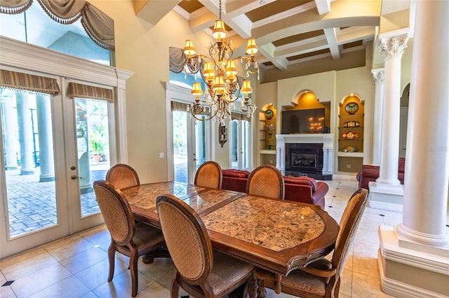 dining room featuring beam ceiling, a high ceiling, ornate columns, french doors, and light tile patterned floors