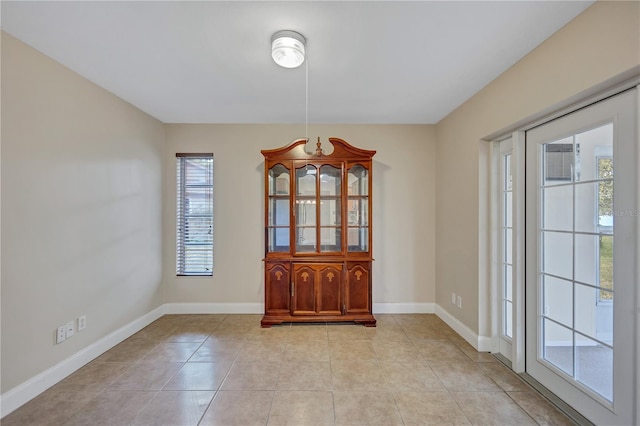 2961 Briar Cliff Dr, Palm Harbor, FL 34684 - interior space with baseboards and light tile patterned floors
